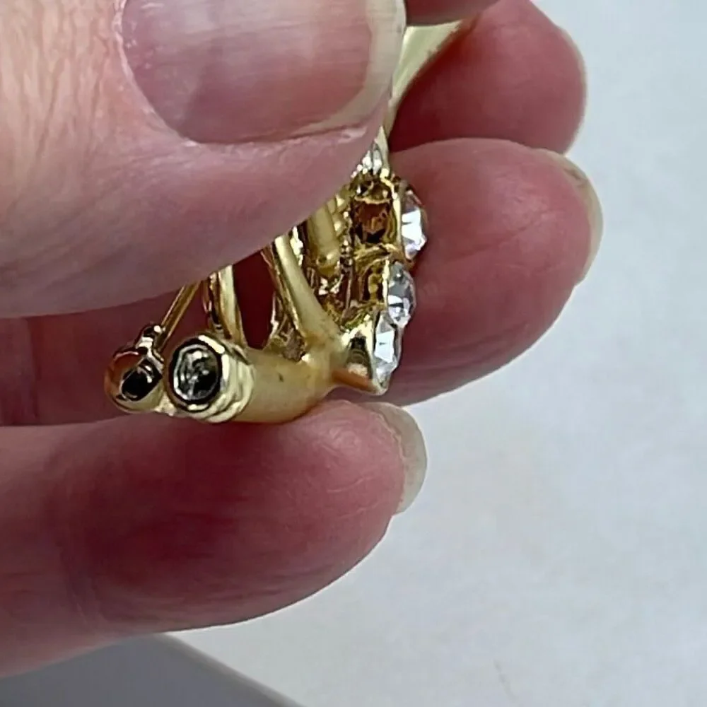 Vintage AGC matte and shiny embellished French Horn brooch.